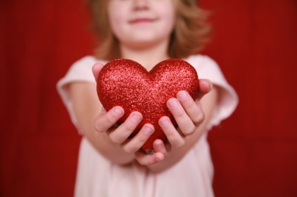 Giving Hearts Day image-girl holding glitter heart